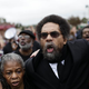 Cornel West (center), along with other demonstrators protesting the shooting death of Michael Brown, marches to the Ferguson police station in Ferguson, Mo., Oct. 13, 2014. In his response to Michael Eric Dyson’s recent critique of him, West has chosen to focus on issues like Ferguson and deflect from their personal falling-out.
Joshua LOTT/AFP/Getty Images